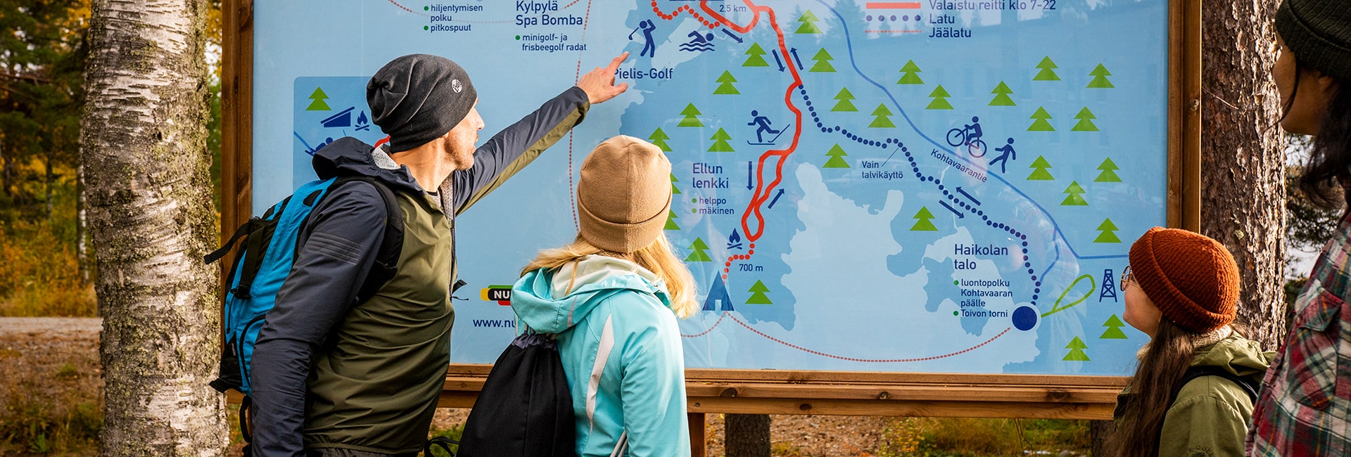 A group of friends exploring the attractions of the Bomba area from the area’s map.